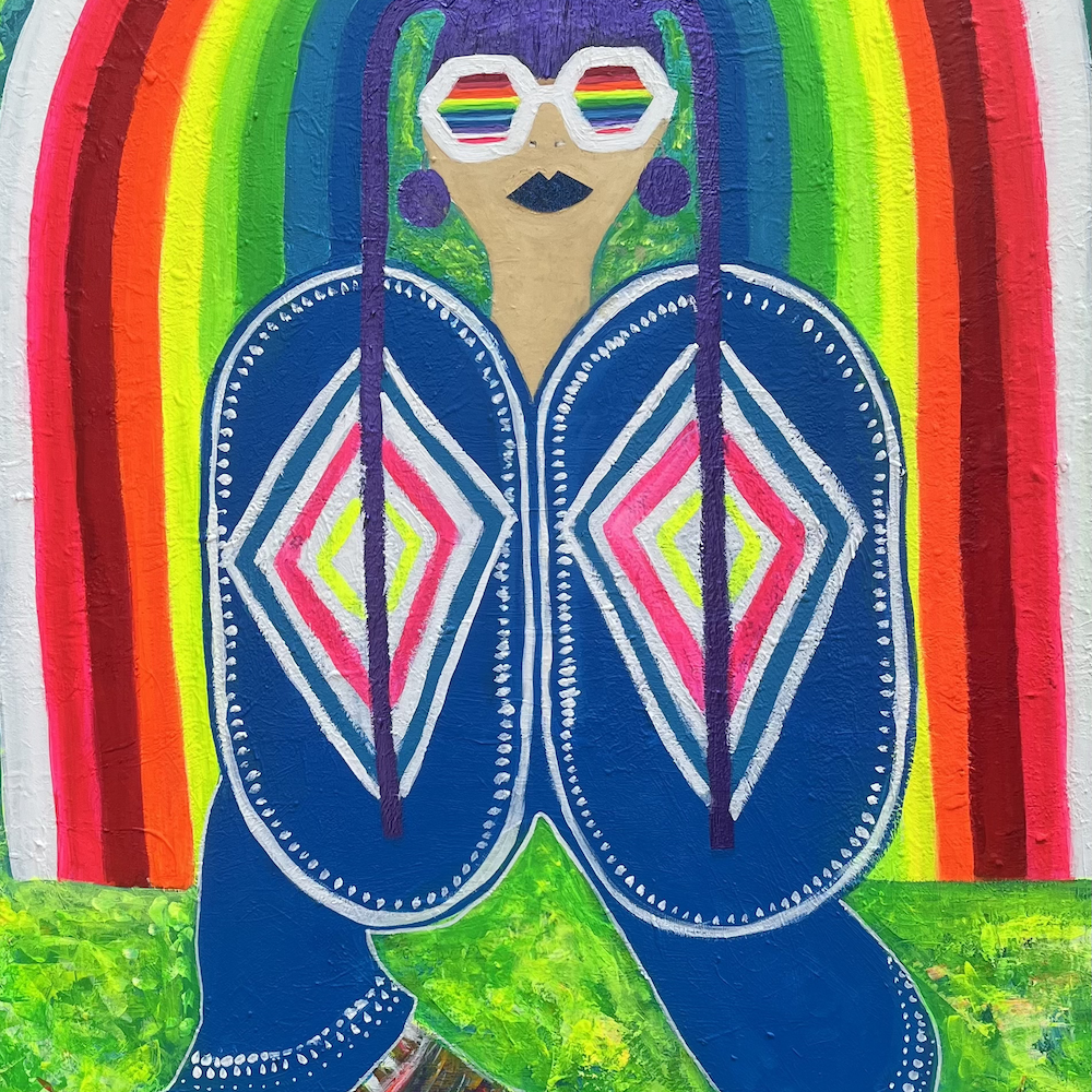 Fotografie von einem Kunstbild. Darauf ist eine Frau mit einem Regenbogen.